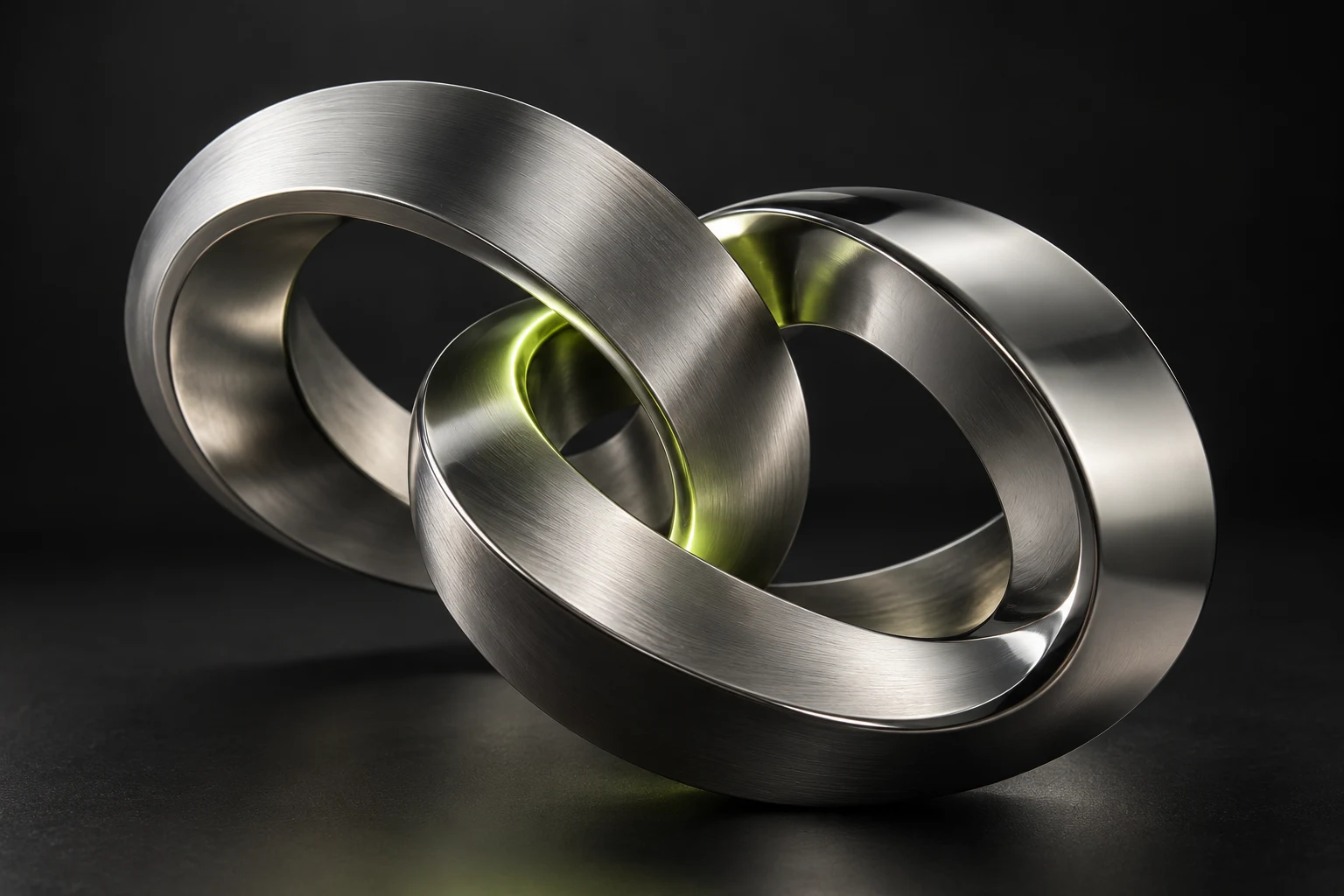 Interlocking metallic forms, illustrating separate processes becoming a connected system